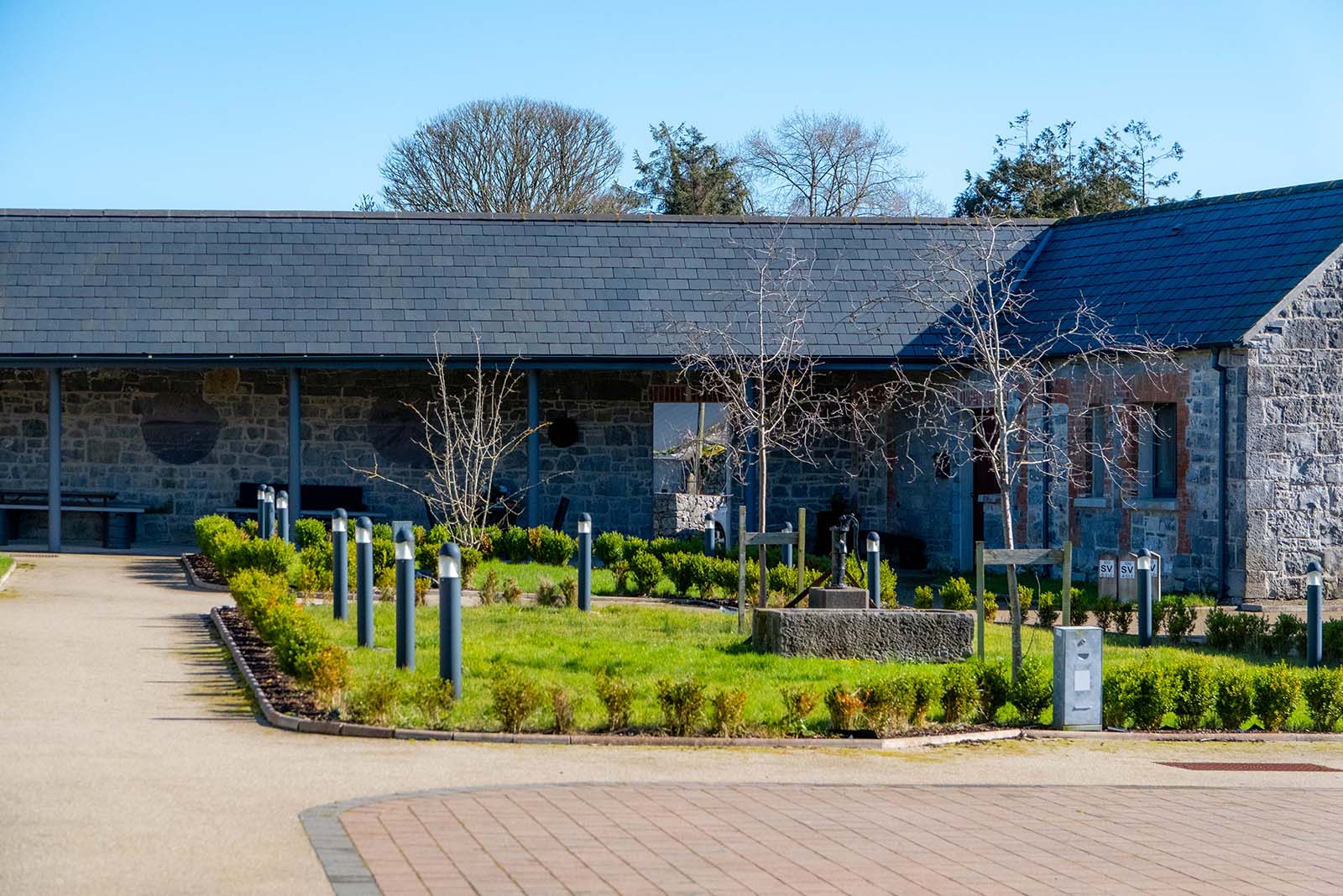 View of courtyard gardens with buildings in background.